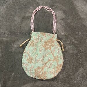 Green and gold embroidered mini bag with pearl straps